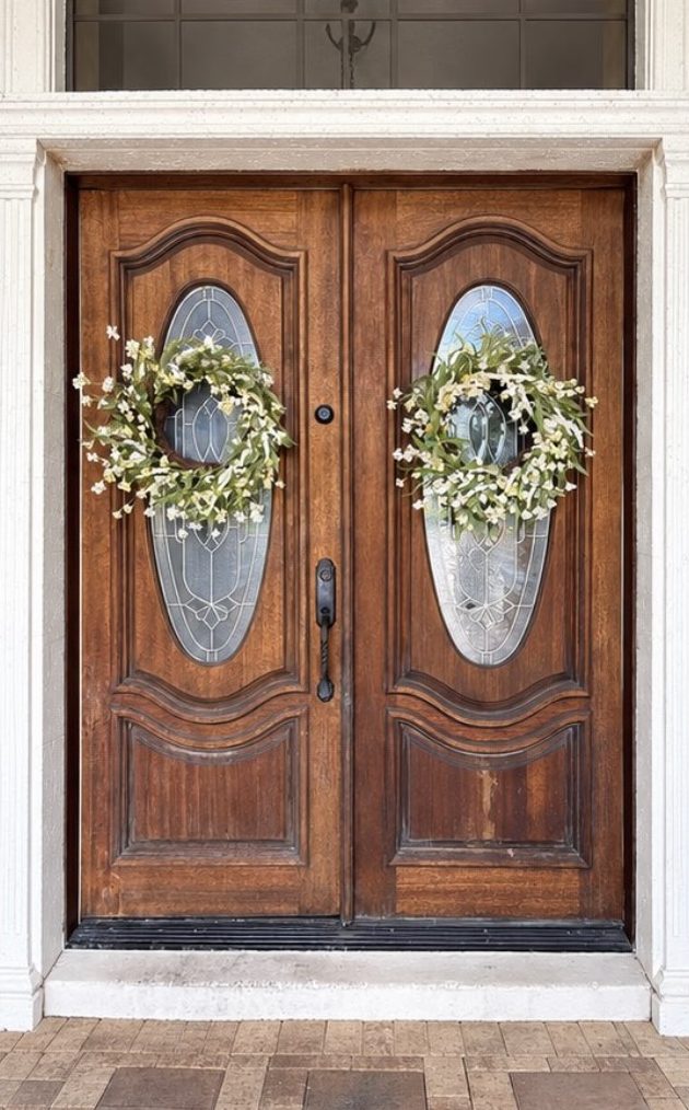 Double wooden front doors refinished in Central Florida — before