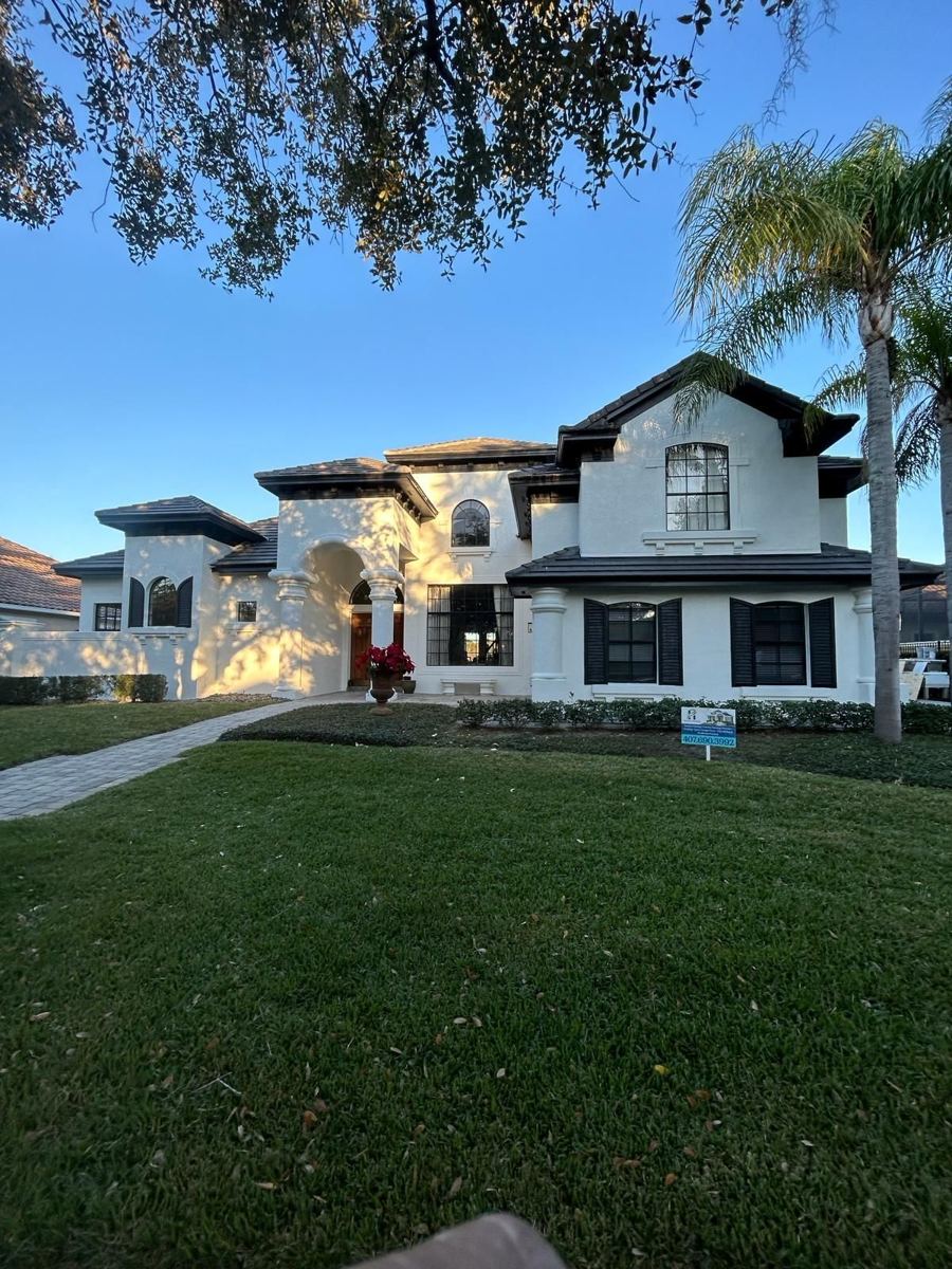 Freshly painted stone-front home exterior in St. Cloud, FL